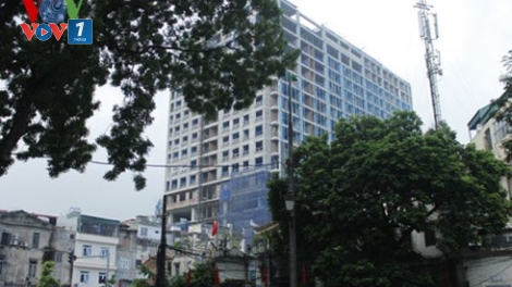 Chủ đầu tư Công ty cổ phần may Lê Trực cam kết tự khắc phục sai phạm công trình tòa nhà 8B phố Lê Trực. (Thời sự chiều ngày 6/10/2015)